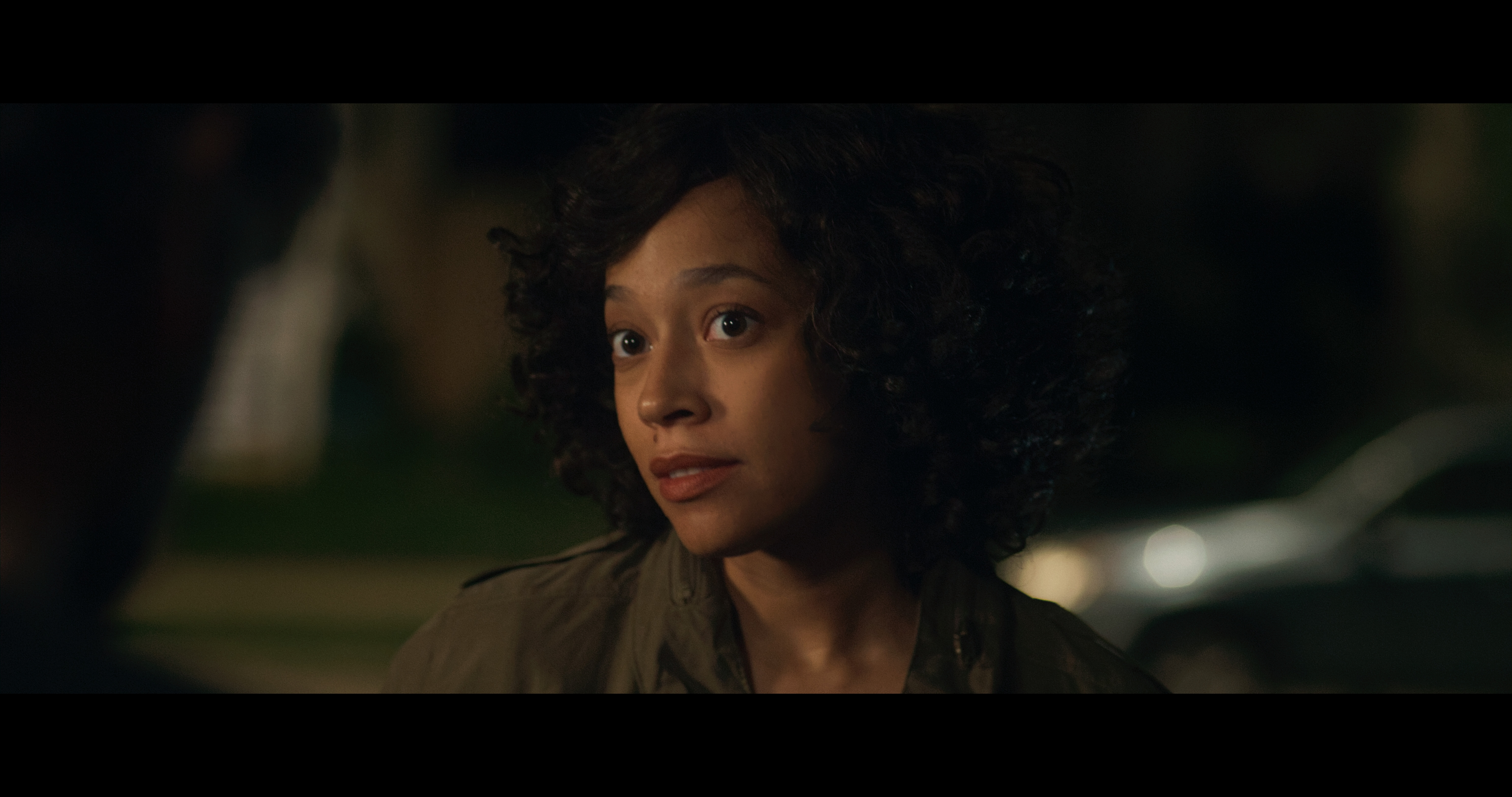 Chandra Russell in &quot;All Happy Families&quot; movie, portraying Dana in a scene that emphasizes her authentic and grounded character.