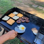 Making breakfast sandwiches for easy camping meals