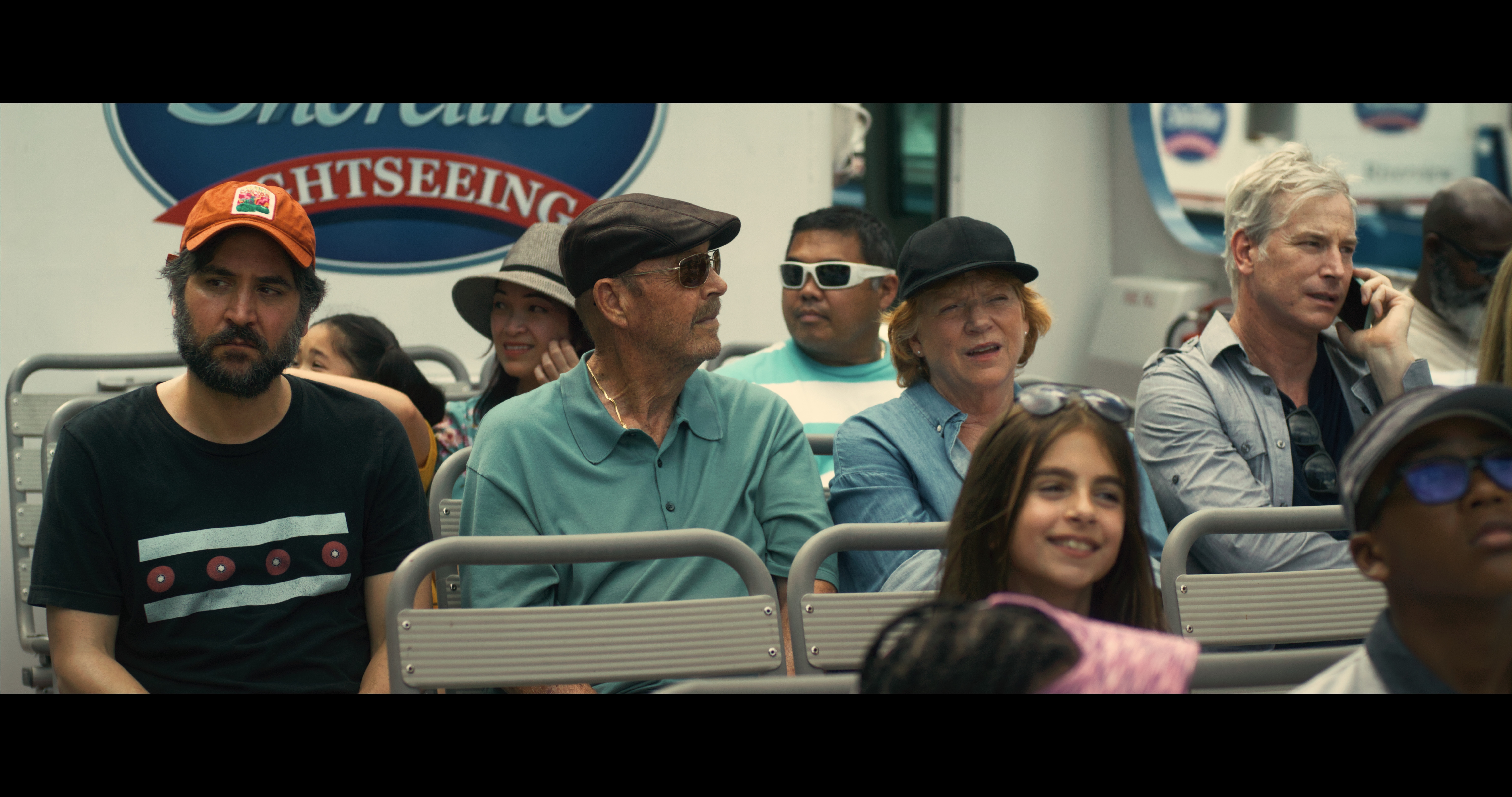 Josh Radnor, John Ashton, Becky Ann Baker, and Rob Huebel in &quot;All Happy Families&quot; movie, showcasing the ensemble cast in a family boat scene.