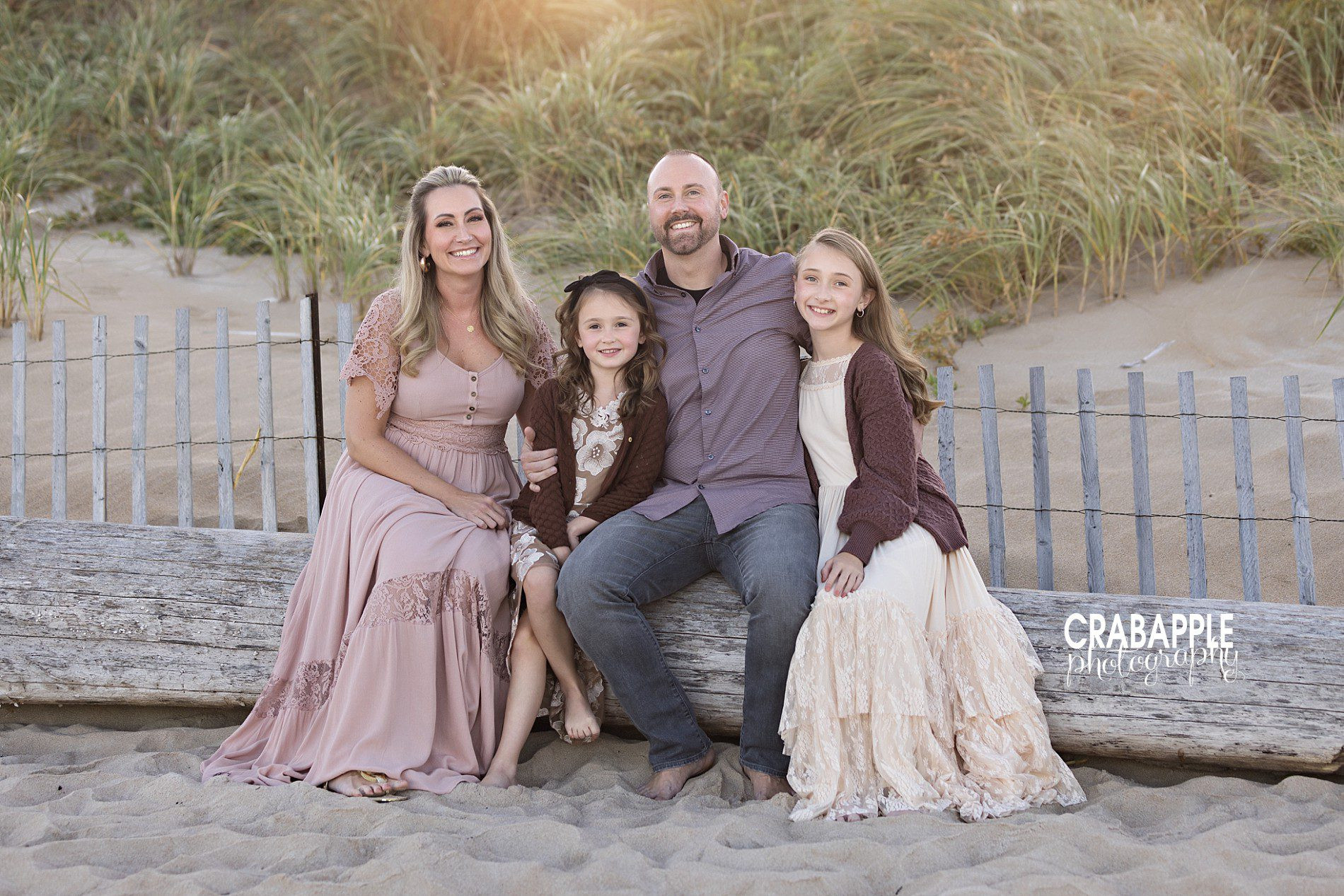 Beach family of four sitting pose, adaptable for fall settings