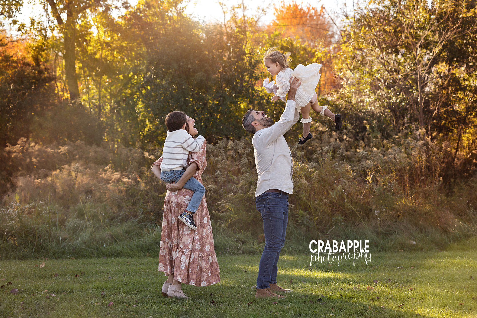 Fun playing family photos in autumn leaves
