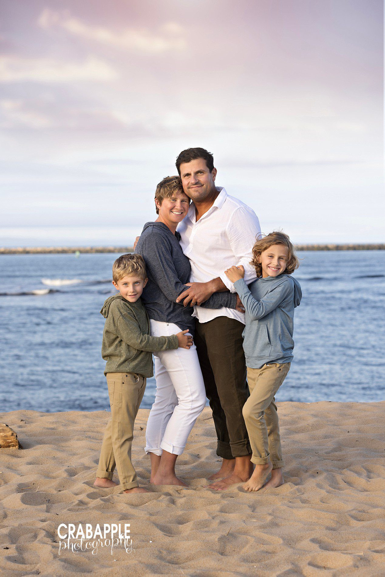 Beach family photos with affectionate poses, adaptable for fall