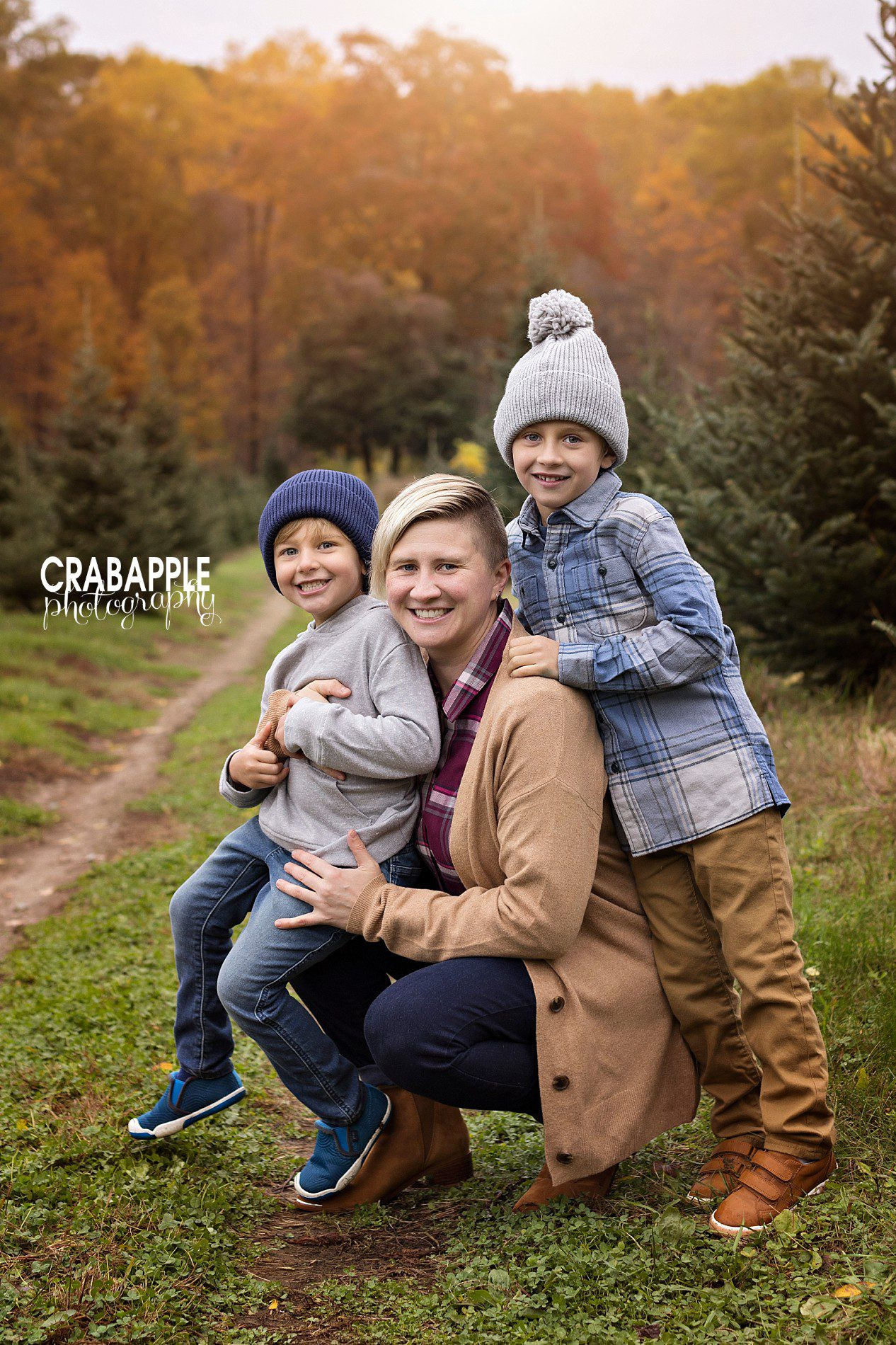 Tree farm family photos with hugs and kisses in fall
