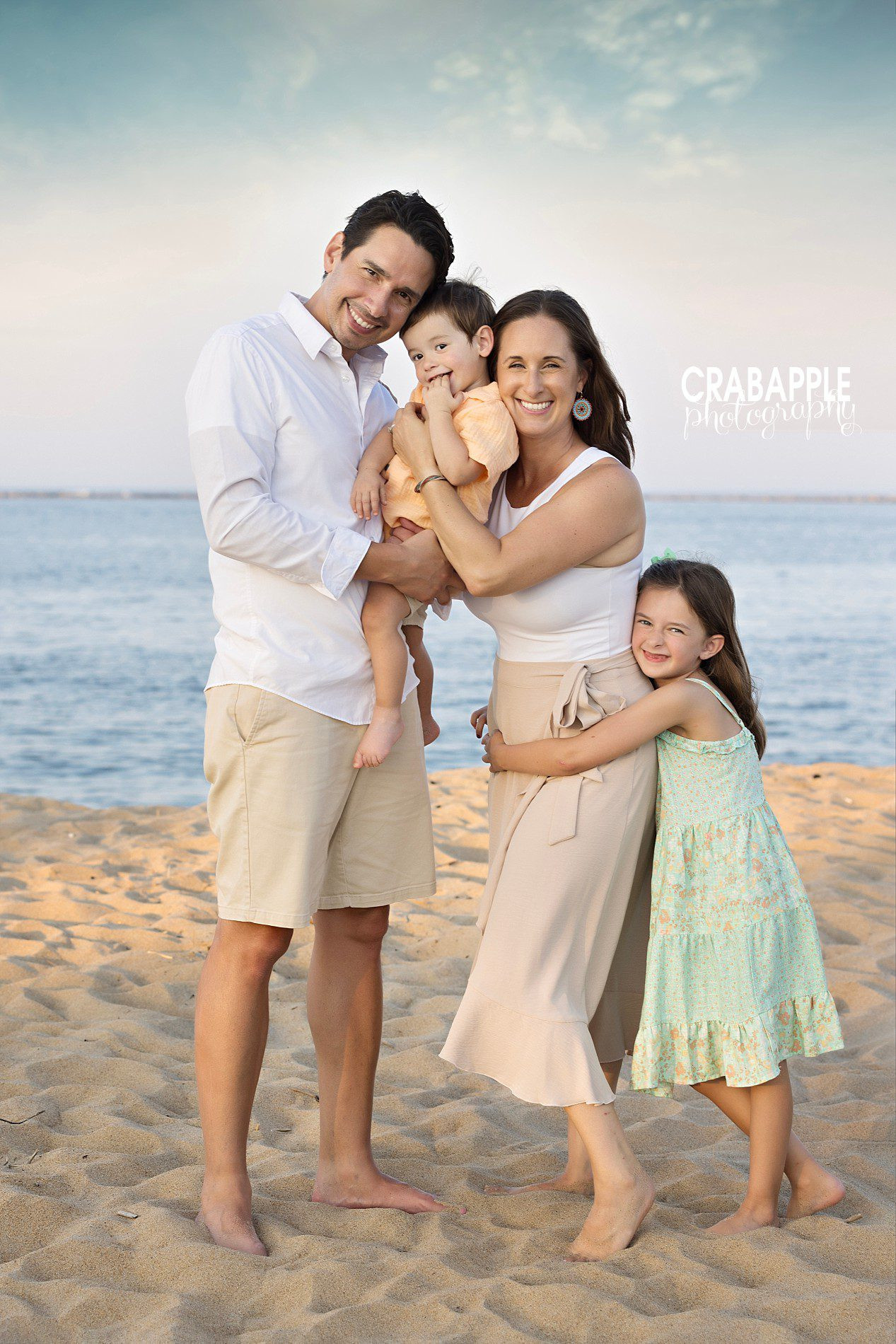 Sweet family photo poses with affection in autumn