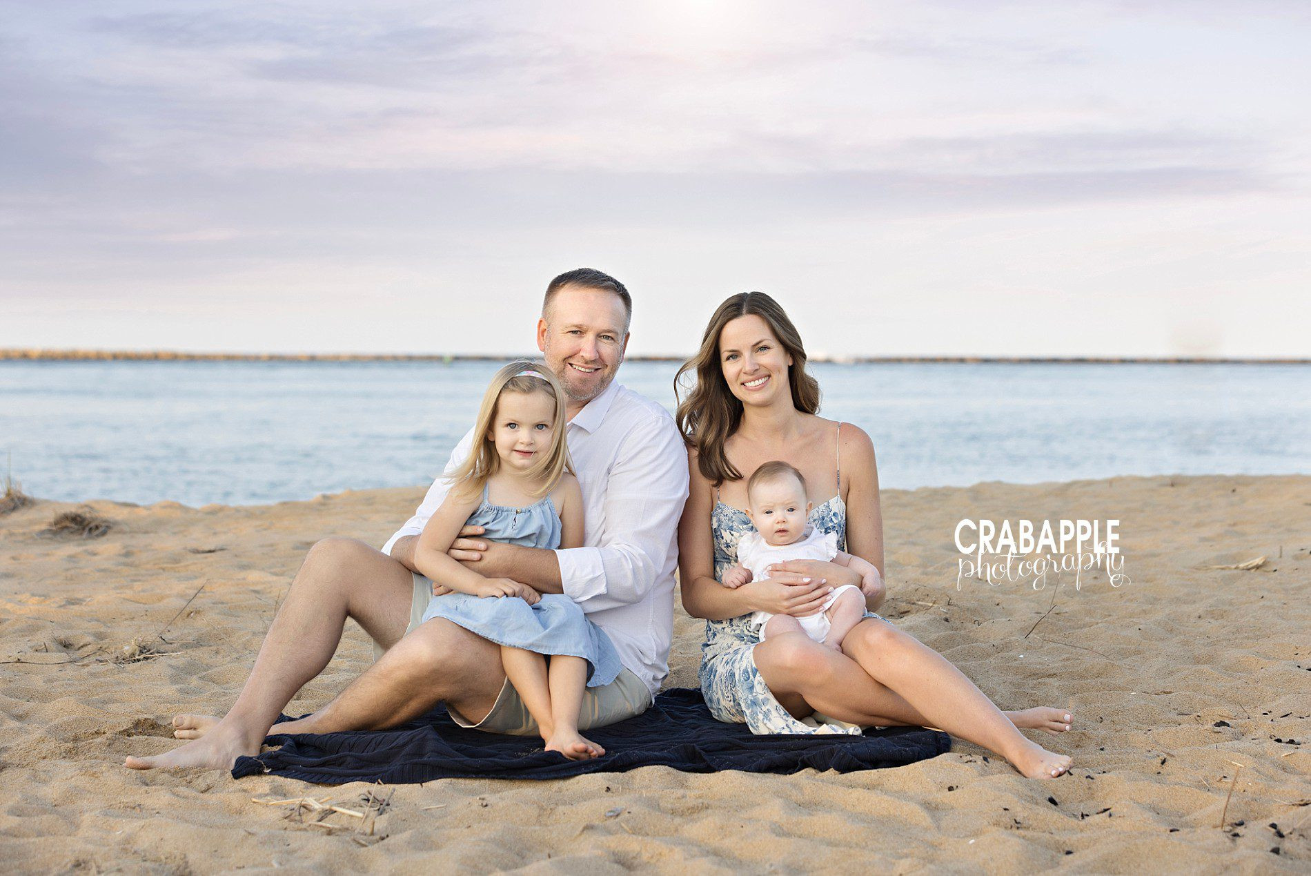 Family portraits with baby and toddler enjoying fall