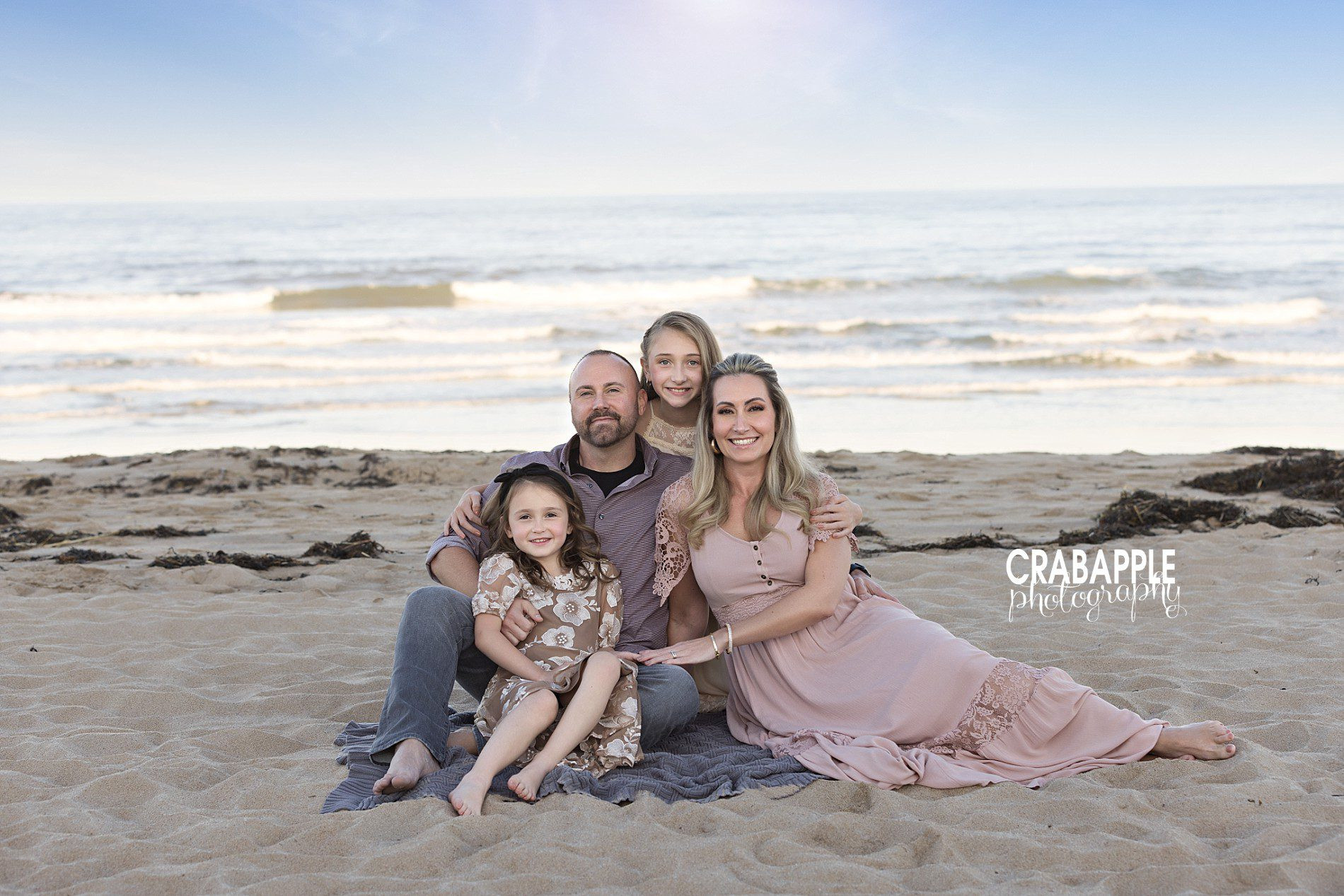 Family of four sitting pose idea for fall photos