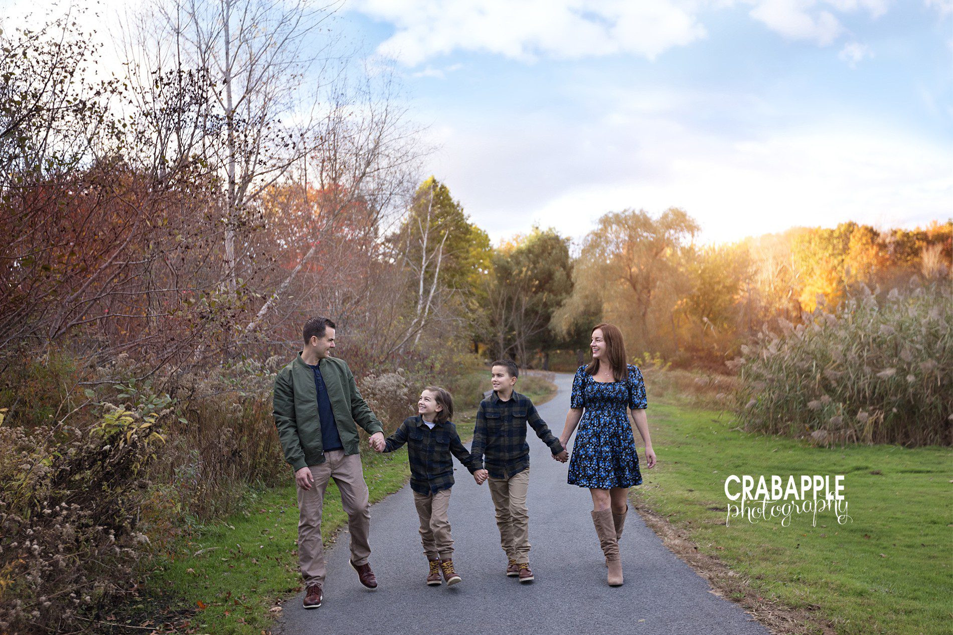 Fall family photos outdoors walking towards camera
