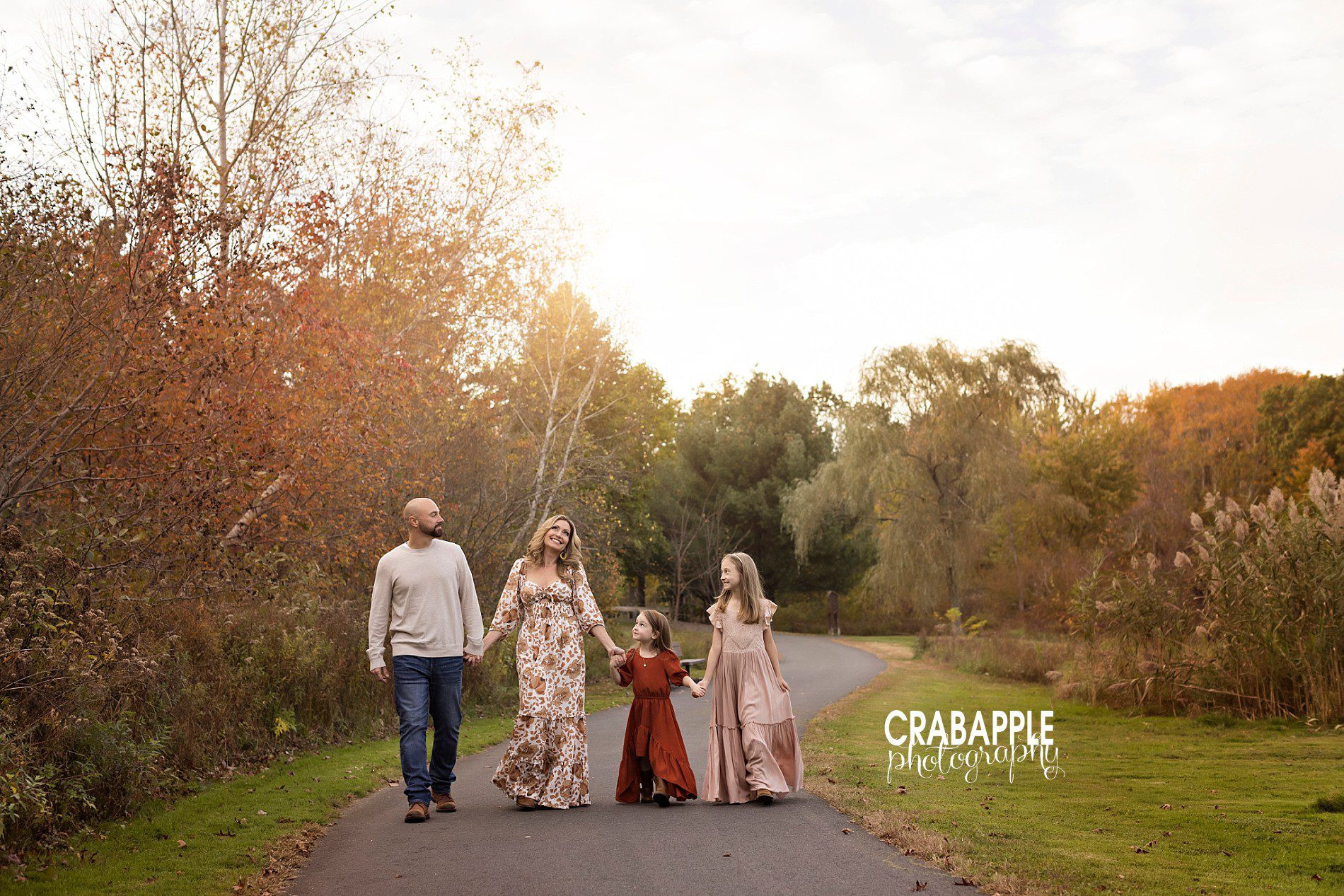 Outdoor fall family photos with walking motion