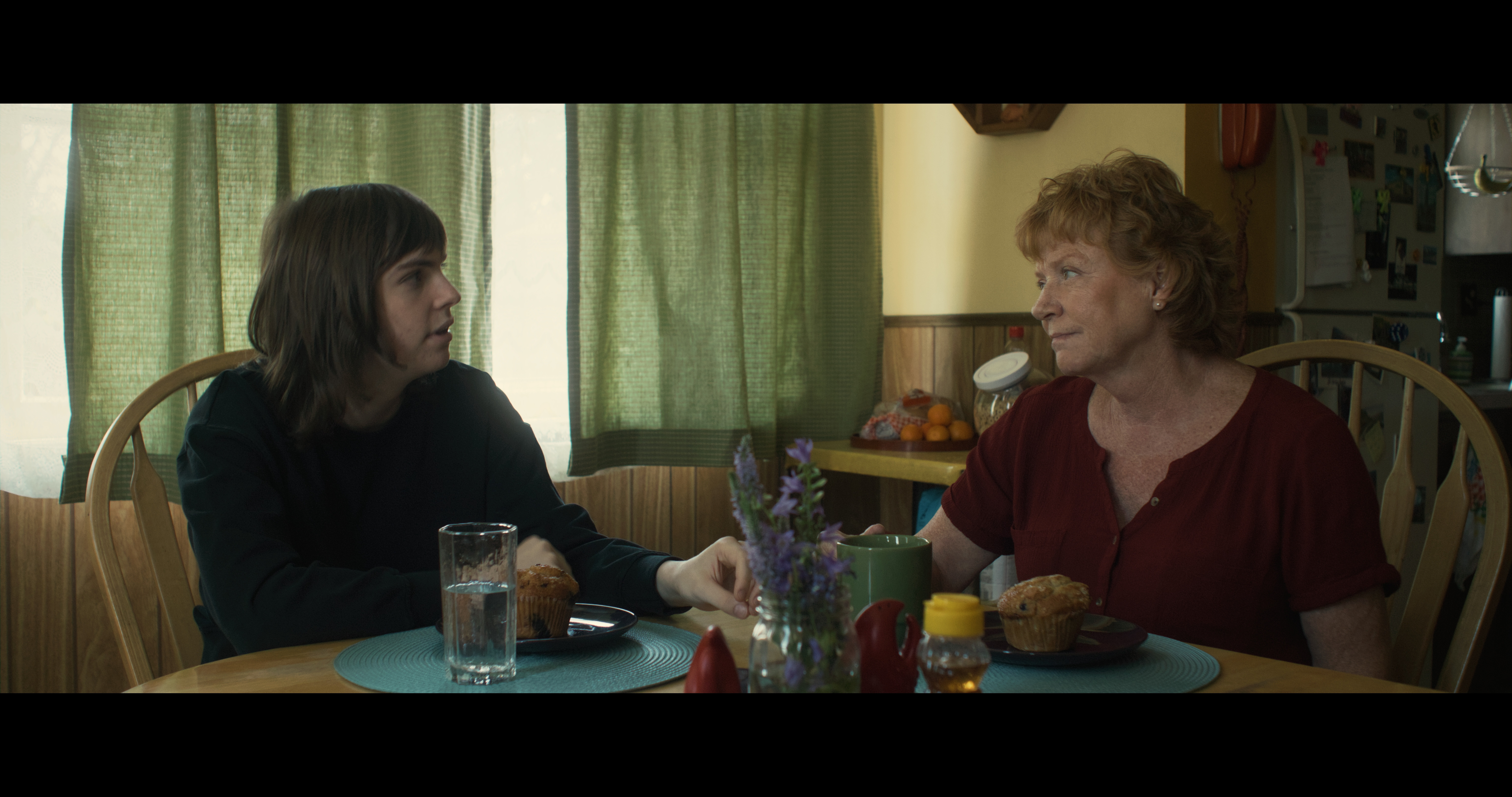 Ivy O’Brien and Becky Ann Baker in &quot;All Happy Families&quot; movie, showcasing the intergenerational family dynamics and acceptance of gender identity.