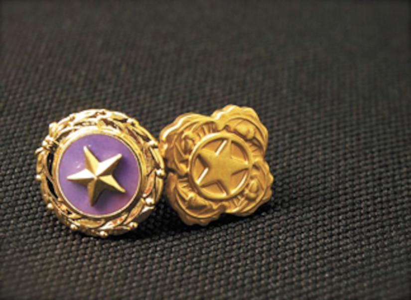 Close-up of a Gold Star Lapel Pin, a symbol of sacrifice worn by Gold Star Families to honor fallen U.S. service members.