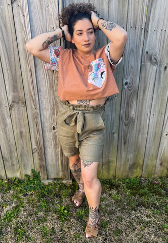Adult wearing the cropped Oversized Tee with horror-themed Easter pocket, styled with jeans, presenting a trendy and subtly themed Easter outfit option for adults.