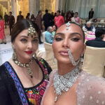 Aishwarya Rai Bachchan and Kim Kardashian attend Anant Ambani's wedding, showcasing the Ambani family wealth and global influence in a lavish celebration.