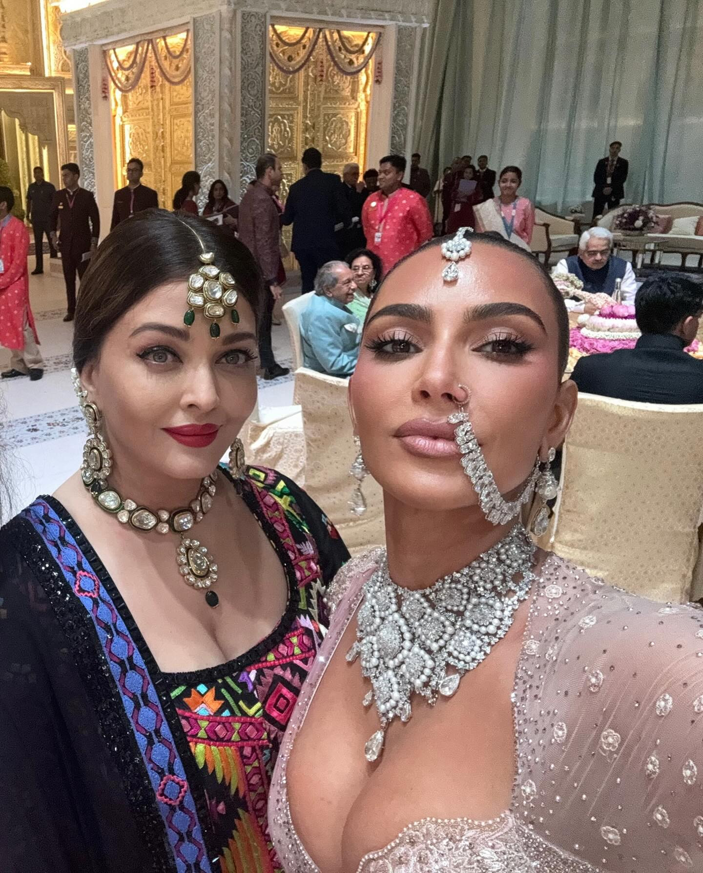 Aishwarya Rai Bachchan and Kim Kardashian attend Anant Ambani's wedding, showcasing the Ambani family wealth and global influence in a lavish celebration.