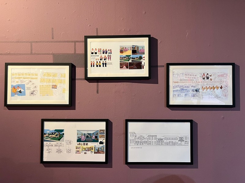 Production art from Family Guy decorating the walls of Giggity Golf
