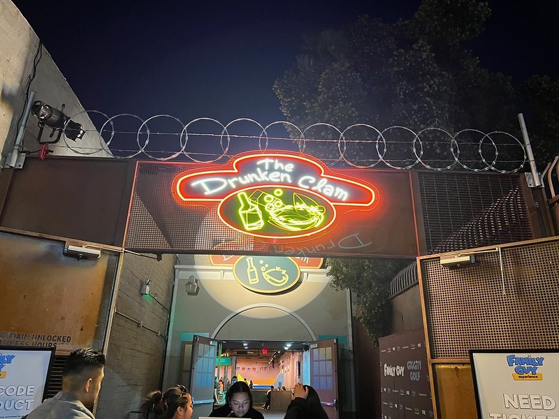 The Drunken Clam sign lit up at Family Guy Giggity Golf
