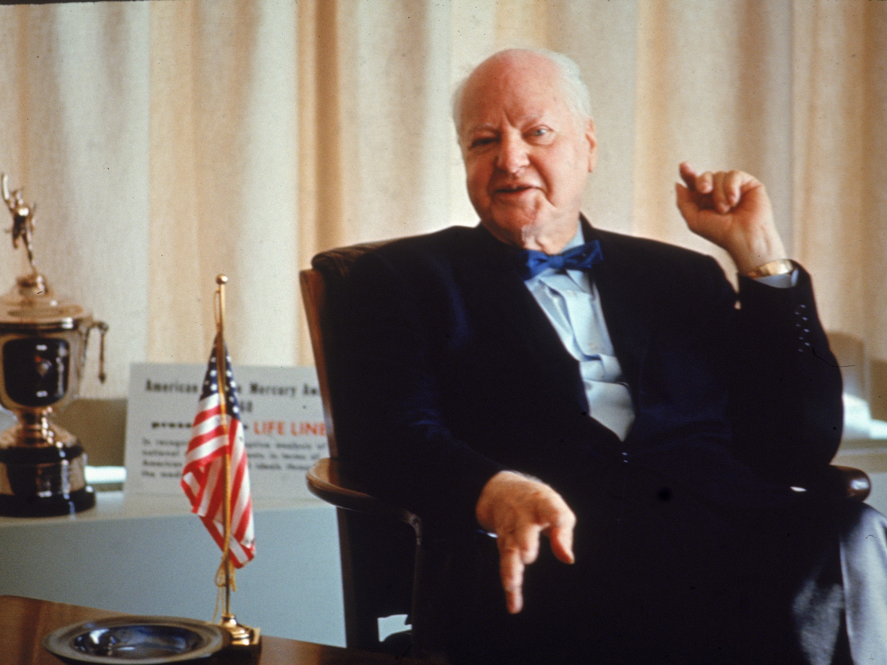 A portrait of H.L. Hunt at his desk in 1968, showcasing his long career and influence