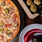 A delicious spread of Italian-American dishes at Spinato's Pizzeria and Family Kitchen in Phoenix, Arizona, showcasing their family kitchen's diverse menu.