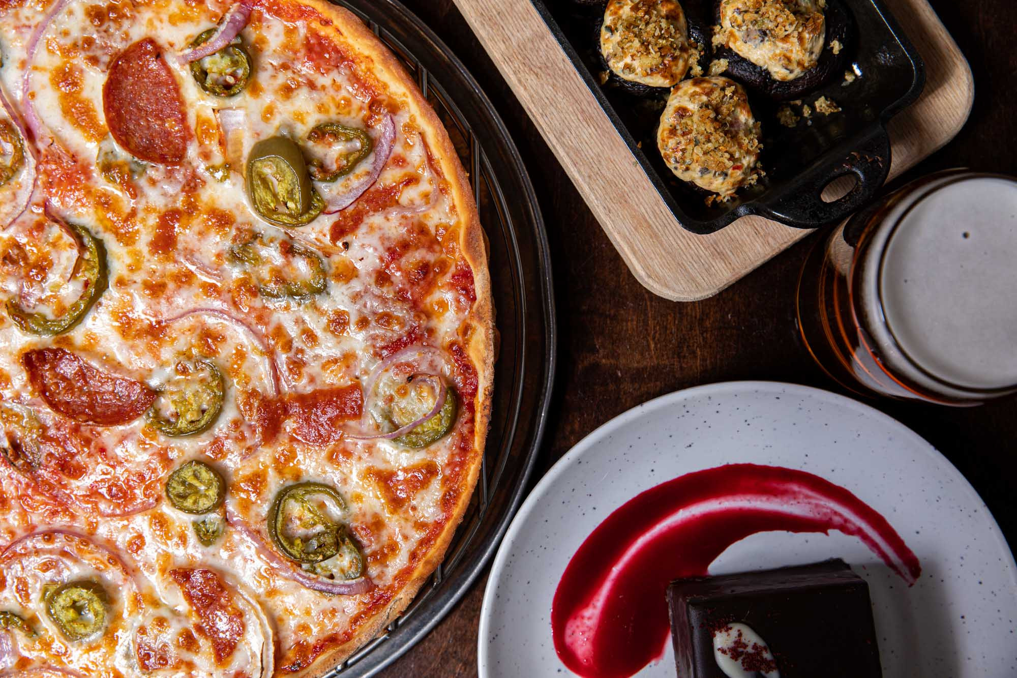 A delicious spread of Italian-American dishes at Spinato's Pizzeria and Family Kitchen in Phoenix, Arizona, showcasing their family kitchen's diverse menu.