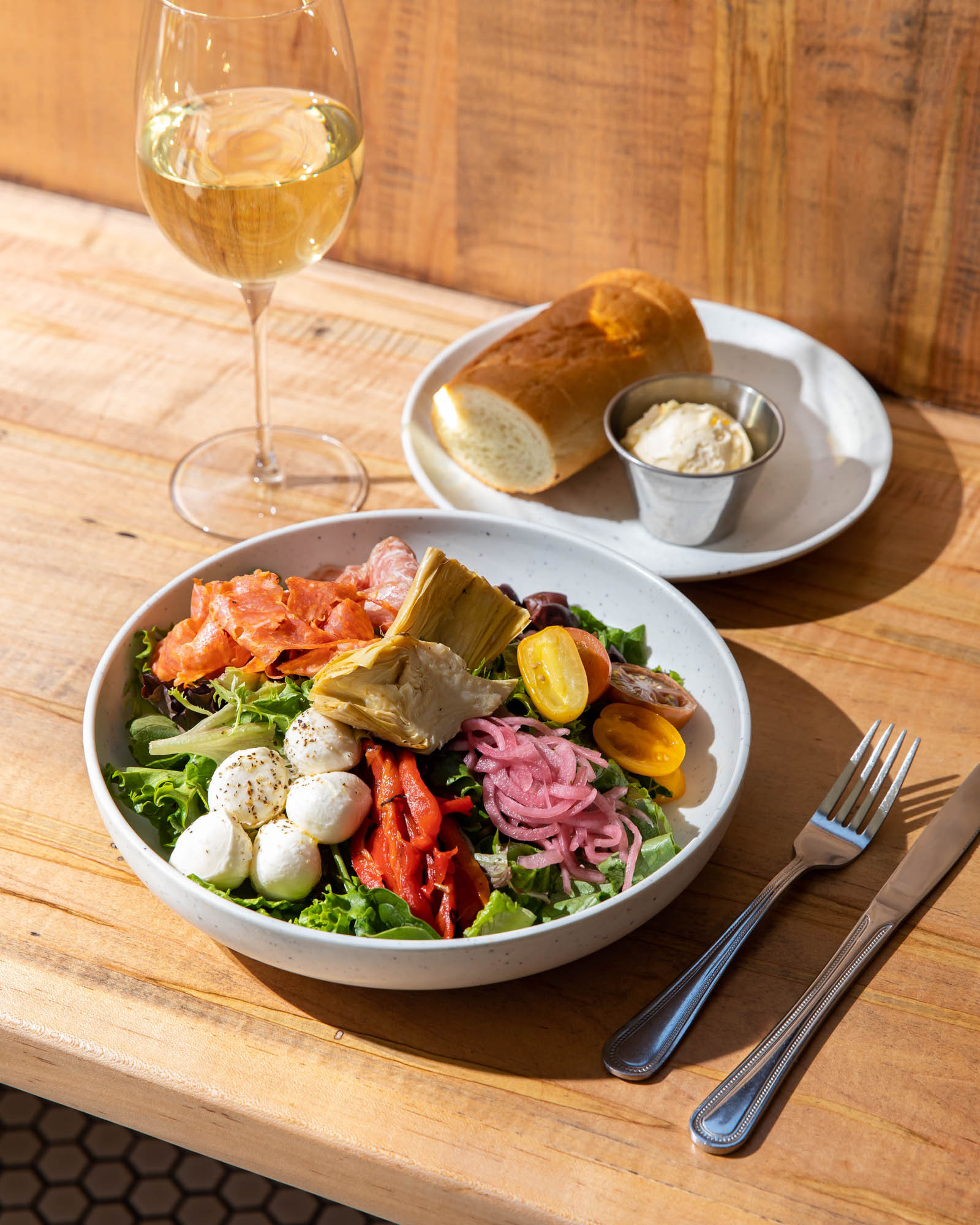 Spinato's Antipasto Salad, a fresh and flavorful salad option at Spinato's Pizzeria and Family Kitchen in Phoenix, Arizona, emphasizing their fresh ingredients.
