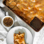 Close-up of a slice of family apple slab pie showing the texture and apple filling