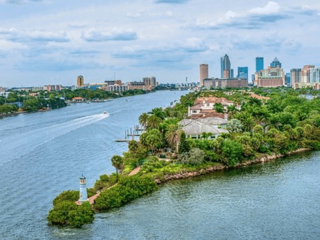 Tampa, Florida skyline and bay aerial view, showcasing urban amenities and waterfront access for families in West Florida