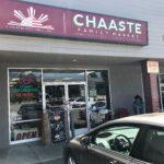 Chaaste Family Market sign with a Honda in front