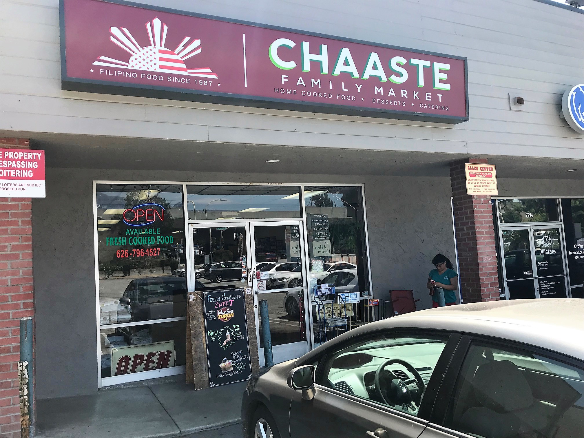 Chaaste Family Market sign with a Honda in front
