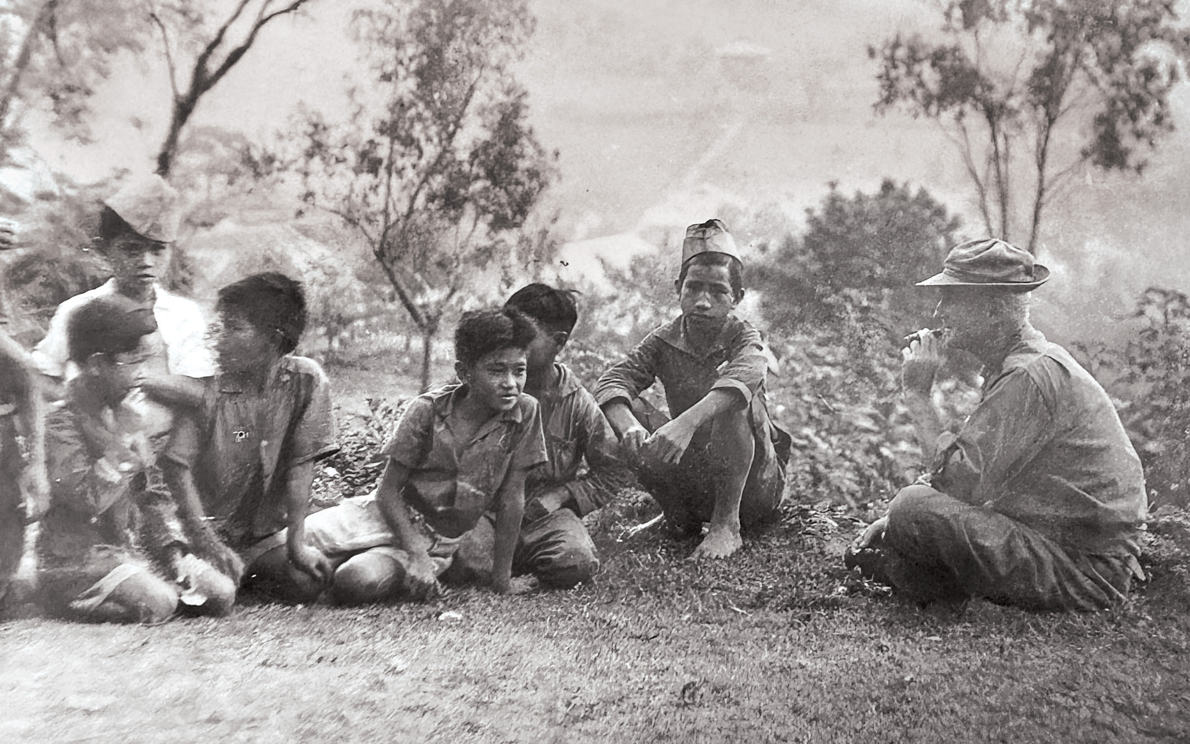 Archival photograph of Victor Lednicky with Igorot children in Benguet, Philippines, circa 1935, illustrating his connection to the region and its people.
