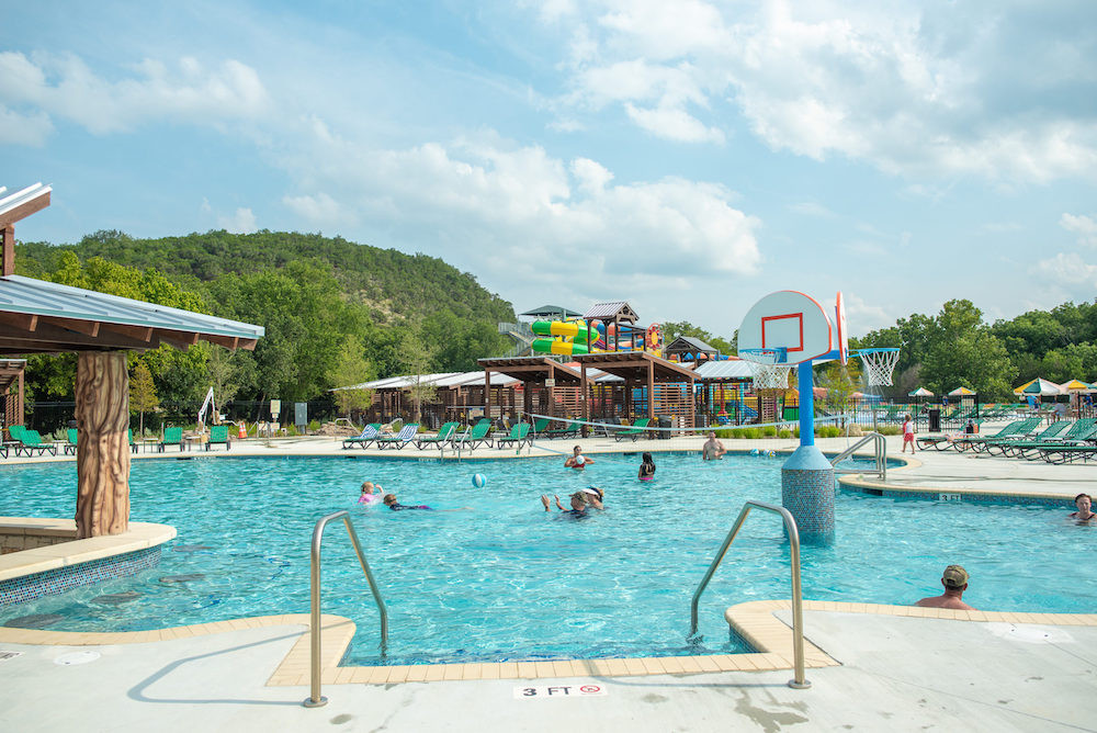Camp Fimfo New Braunfels family camping, Guadalupe River camping Texas, Texas family camping resorts, New Braunfels family vacation, Texas campgrounds with water parks, Camp Fimfo amenities for kids, family tubing Guadalupe River, luxury camping Texas, RV resorts Texas, Texas family outdoor vacations,
