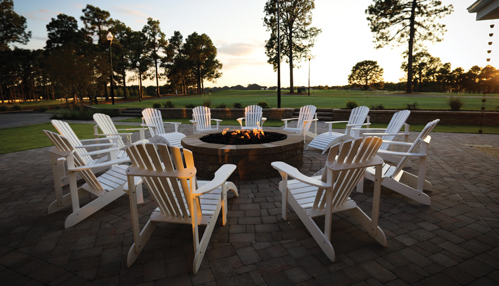 Relaxing fire pit area at Heartwood Eatery, the dining venue at Longleaf Golf &amp; Family Club, perfect for unwinding after a round of golf.
