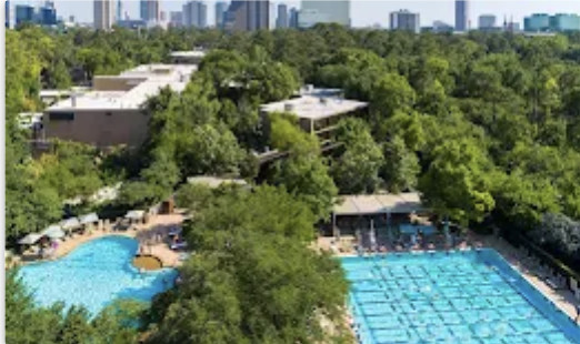 Poolside dining and relaxation area at The Houstonian Hotel, Club, and Spa, highlighting the resort's health-conscious atmosphere.