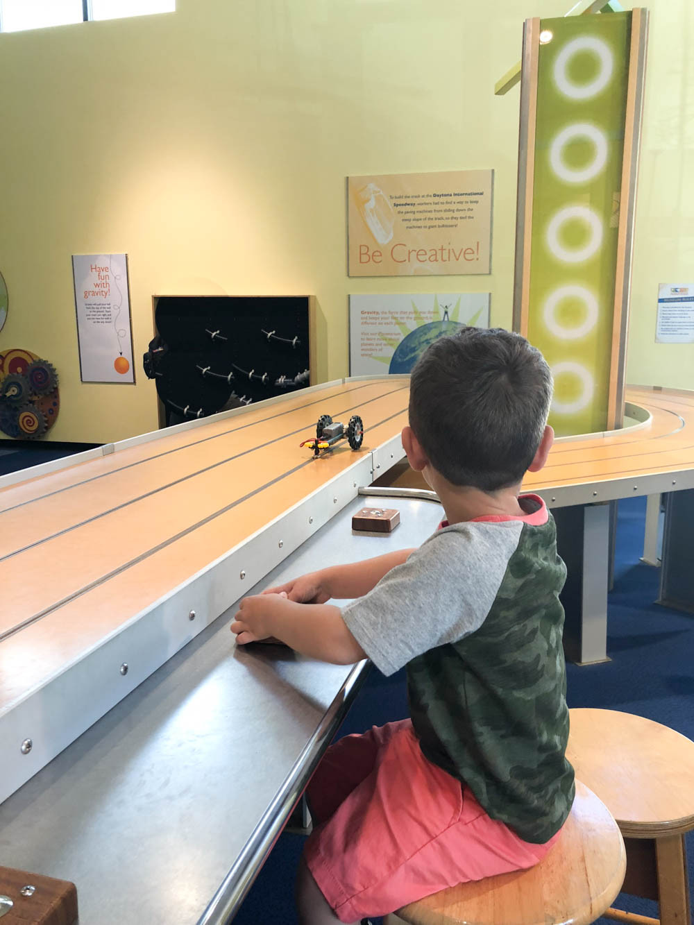Children interacting with car exhibit at Daytona Beach Museum of Arts and Sciences