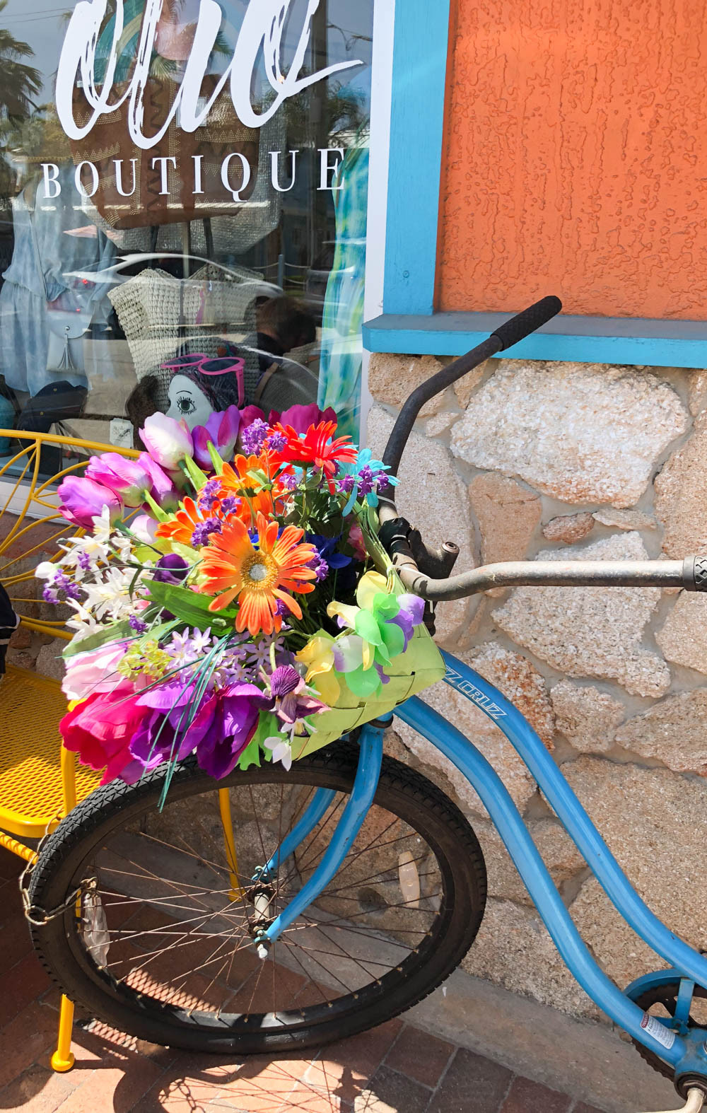 Boutique shops along a palm-lined street in New Smyrna Beach Florida