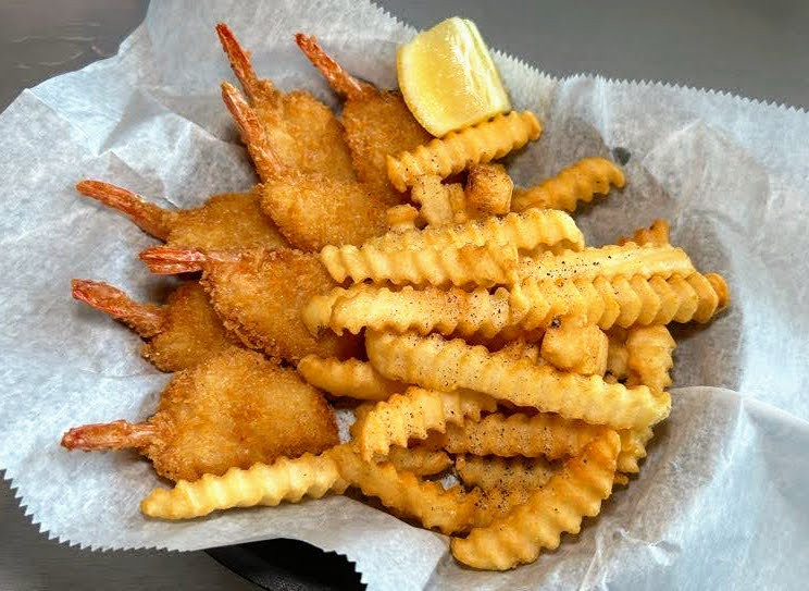 Crispy Fried Shrimp Basket with golden french fries at Nick's Family Restaurant – a popular seafood choice on their diverse menu.