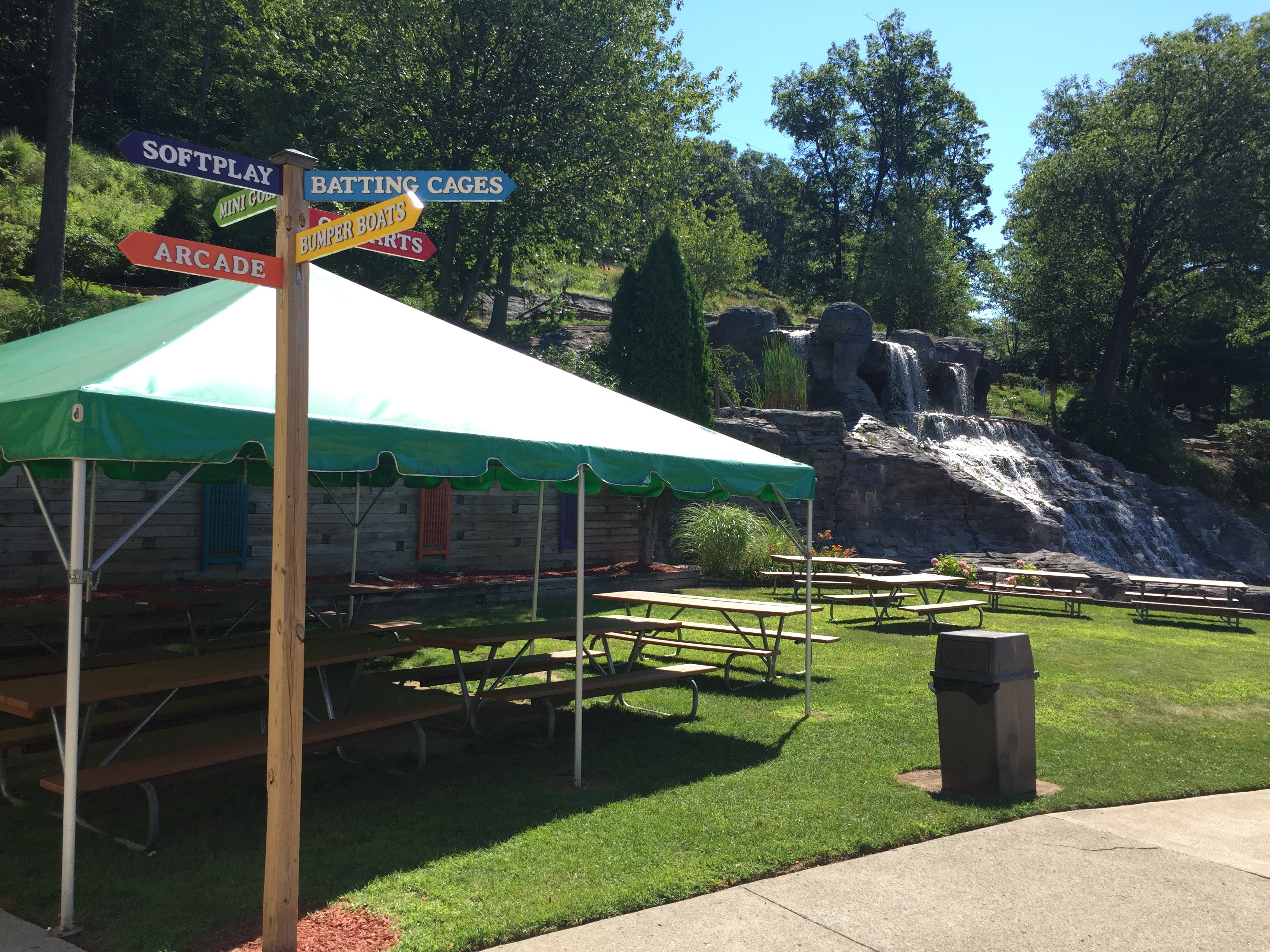 A sign and waterfall feature on the mini golf course at Lahey Family Park, enhancing the scenic and playful atmosphere.