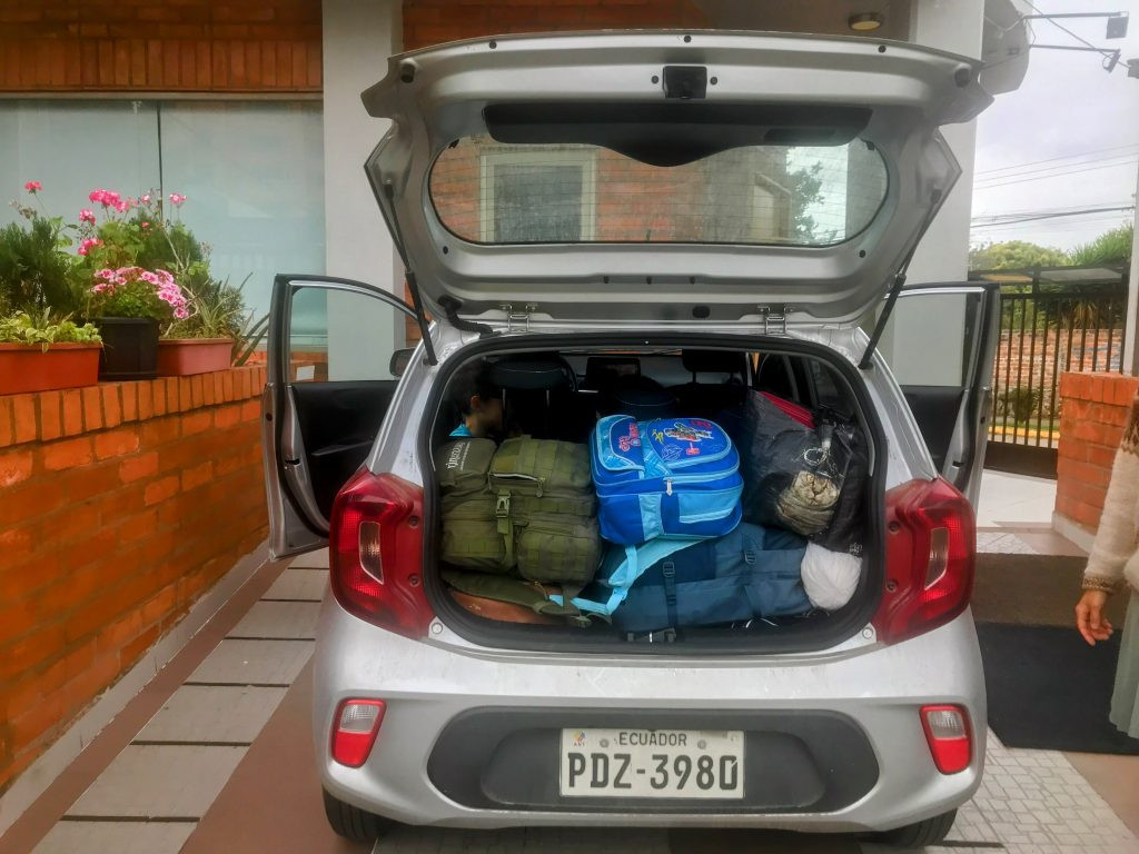 Family luggage packed in a compact car