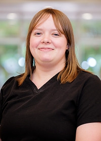 Hannah smiling in office