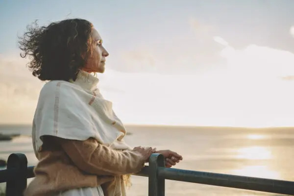 Woman looking into distance, representing thoughtful legal counsel