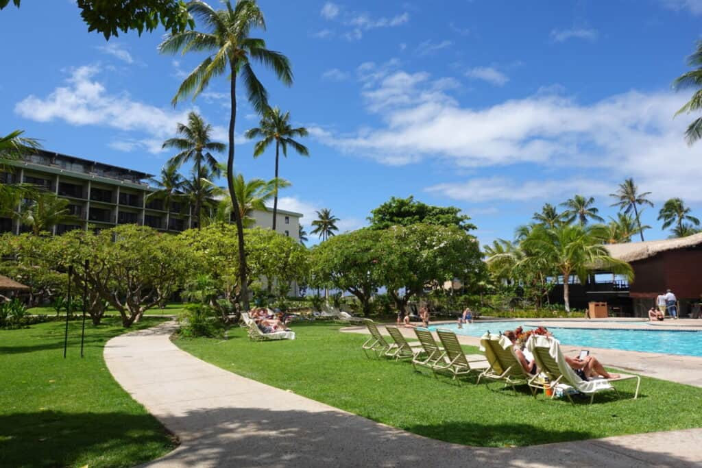 The whale-shaped pool and spacious lawn area at Kaanapali Beach Hotel, a family-friendly Maui resort.