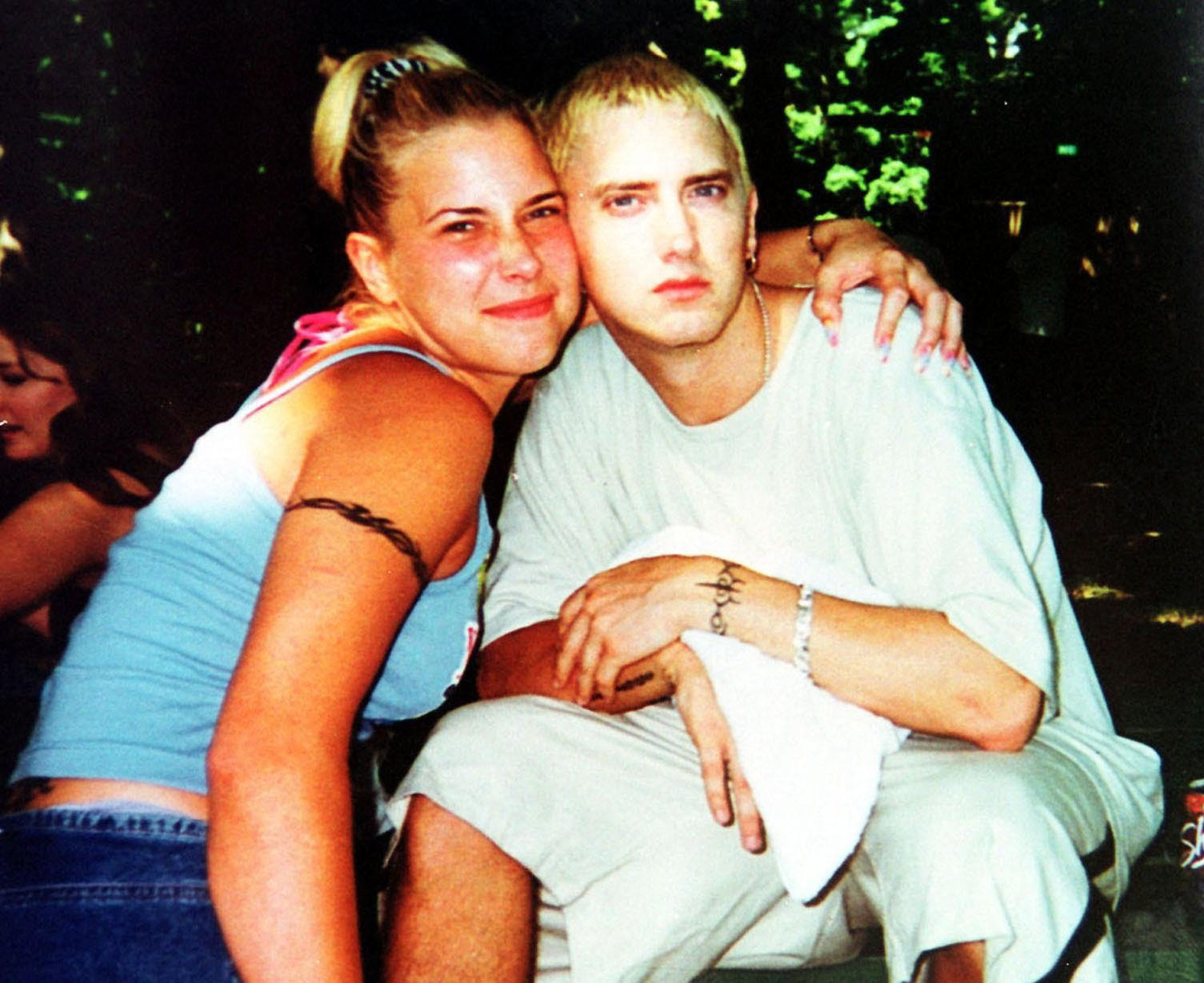 Young Eminem and Kim Scott pictured in their youth, reflecting their long history