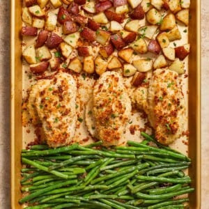 Parmesan crusted chicken sheet pan dinner cooked on baking sheet.