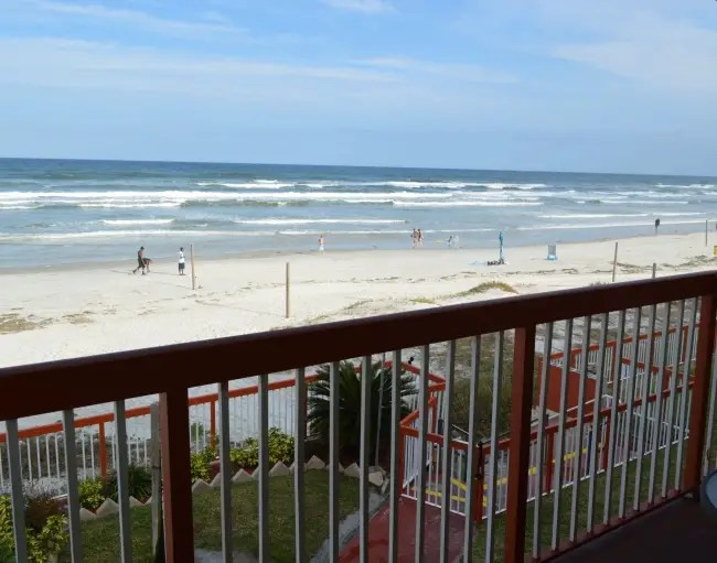 Outdoor patio overlooking a beach scene in Daytona Beach