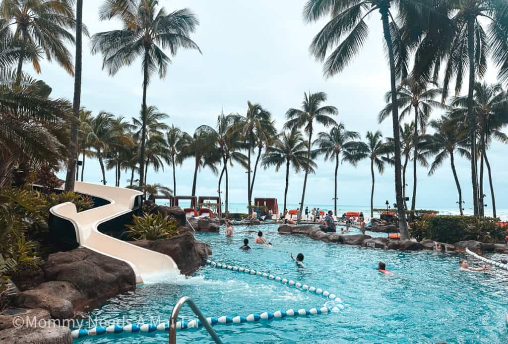 View of the waterslide pool at Sheraton Waikiki, with kids playing.