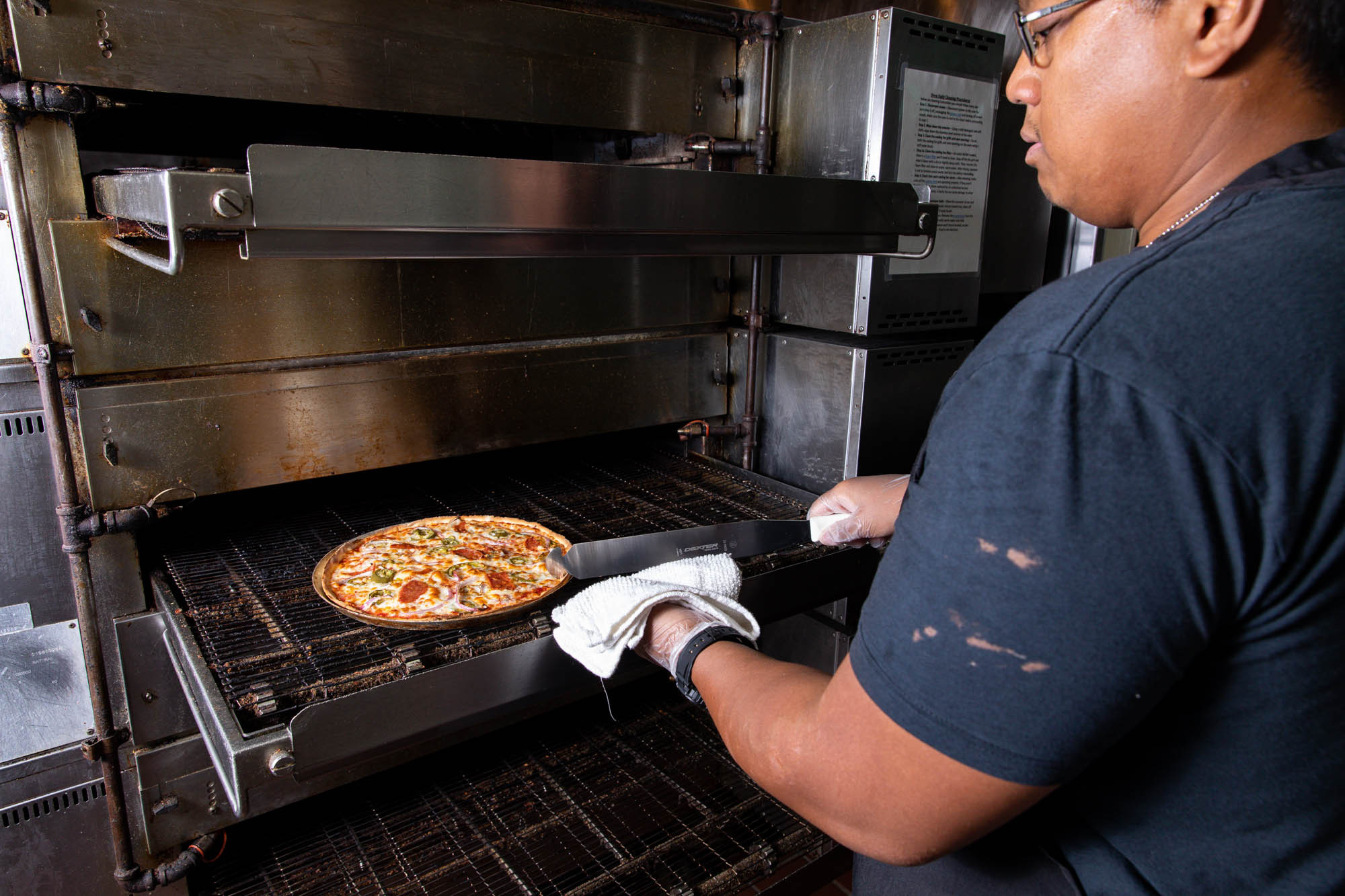 Spinato's Courtside Classic Pizza, a signature dish at Spinato's Pizzeria and Family Kitchen in Phoenix, Arizona, highlighting their pizza expertise.