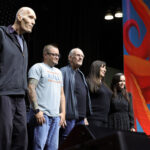 Group photo of Addams Family cast at L.A. Comic Con 2024, featuring Carel Struycken, Jimmy Workman, Christopher Lloyd, Anjelica Huston, and Christina Ricci.