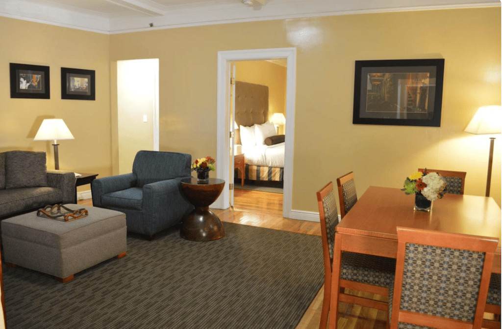 Best Western Hospitality Plus NYC Suite Alt Text: A modern and spacious suite at the Best Western Hospitality Plus in NYC, featuring a fully equipped kitchen and comfortable living area for families.