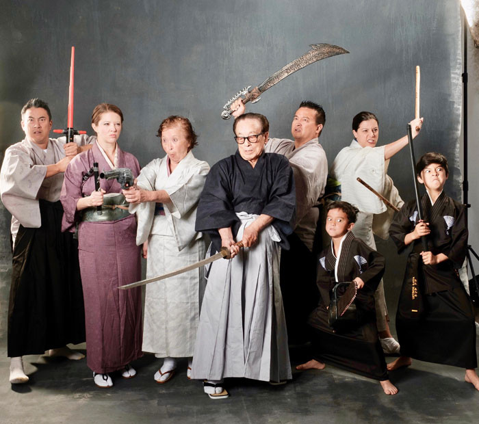 A family dressed in traditional Japanese clothing, posing for a formal portrait. The alt text is: Formal family portrait in traditional Japanese clothing, reflecting cultural traditions and values