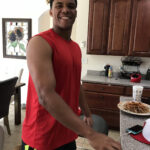 Juan Soto with his host family in their kitchen