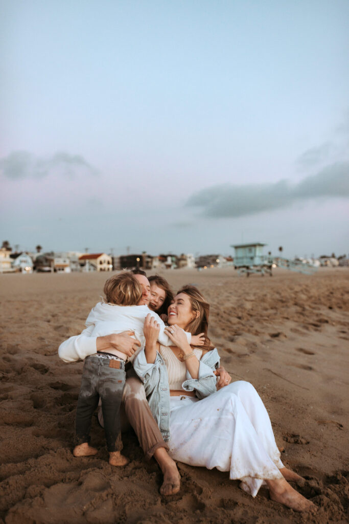 Two sisters in a family photoshoot by the beach