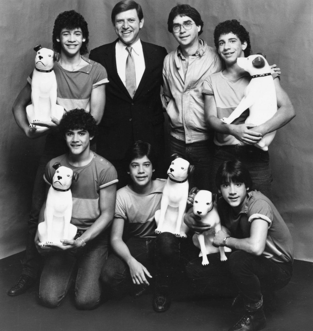 Jose Menendez pictured with former members of Menudo, including Roy Rossello